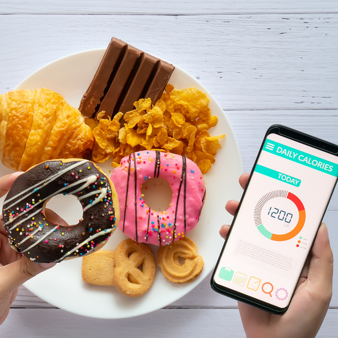 picture of a calorie tracking app as someone eats a donut